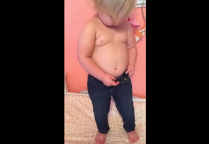toddler squeezing into jeans